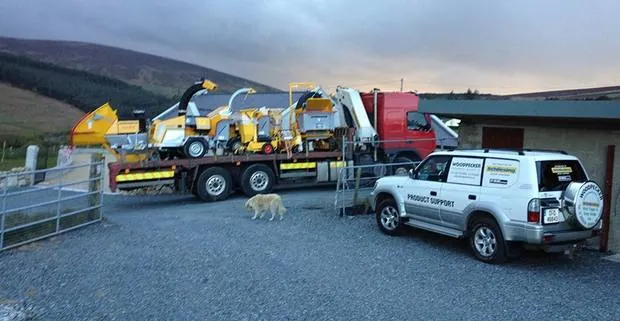 Woodpecker Environmental delivery truck and trailer loaded with Schliesing wood chippers at the Glencullen yard